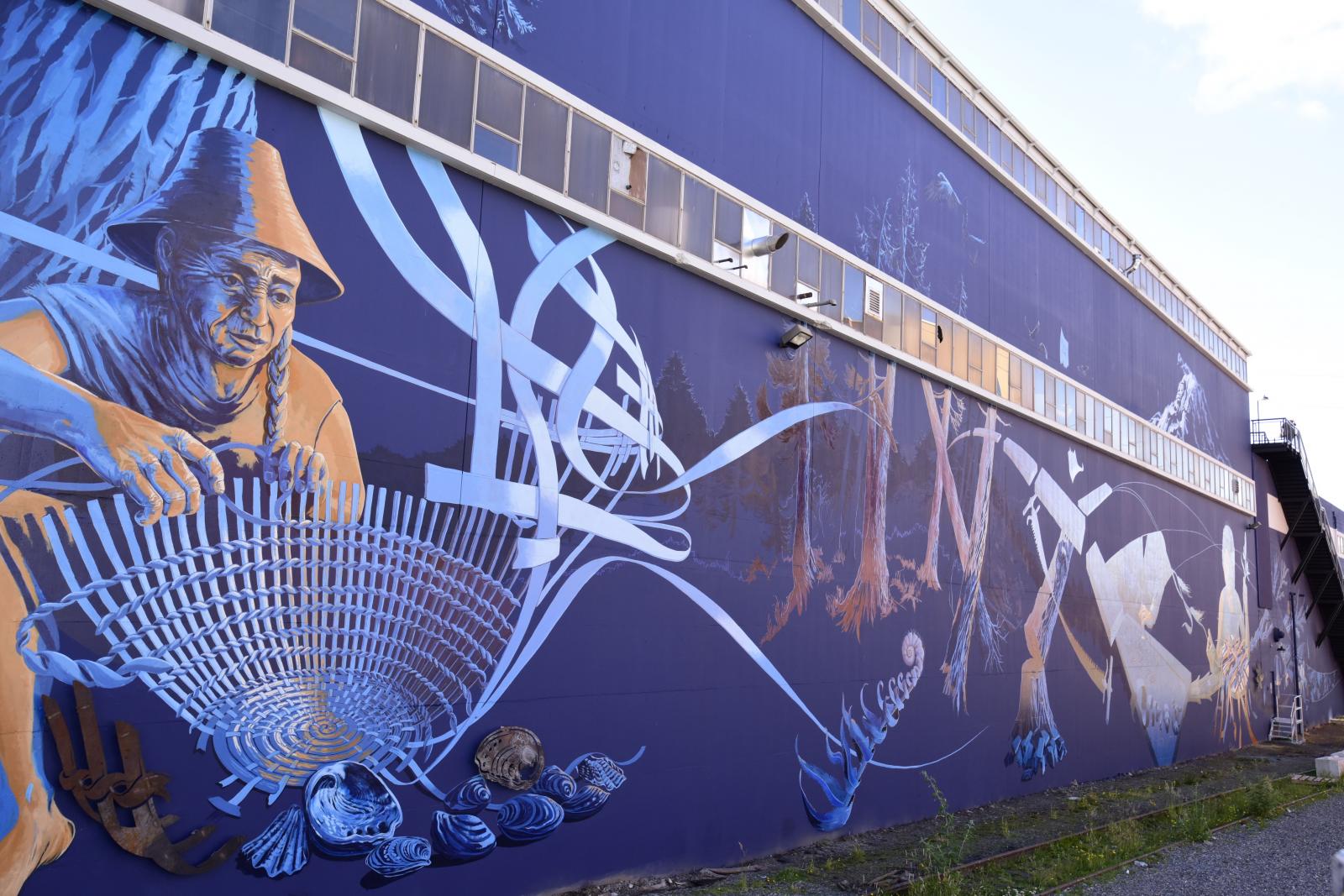Image of Working Forward, Weaving Anew on the side of the 7 Seas Brewery building 