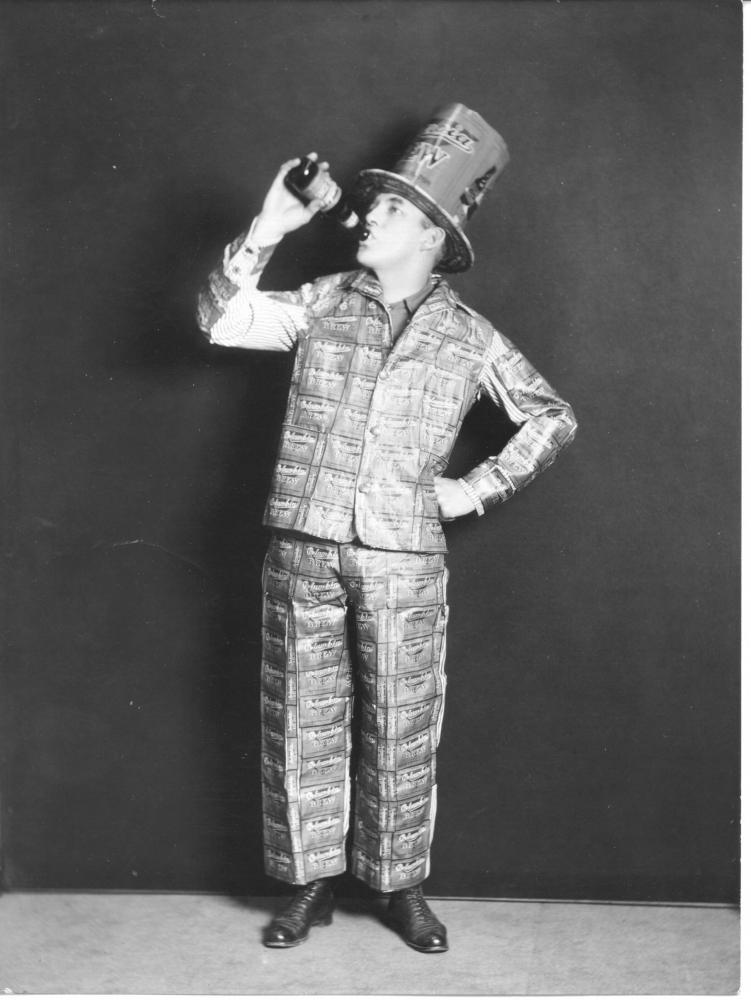 A fan of Columbia Brewing Company’s &quot;near beer&quot; models a suit for not-just-any occasion. The jacket and pants have been made from Columbia Brew labels. (Photo by Richards Studio, used with permission from Tacom