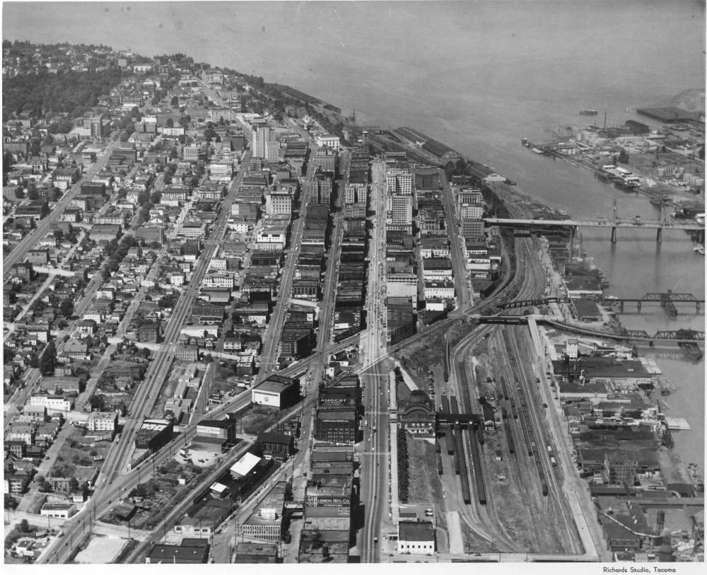 An aerial view of the city (1948). Prairie Line Trail in the center. Thea Foss Waterway off to the right (photo by Richards Studio, used with permission from Tacoma Public Library).