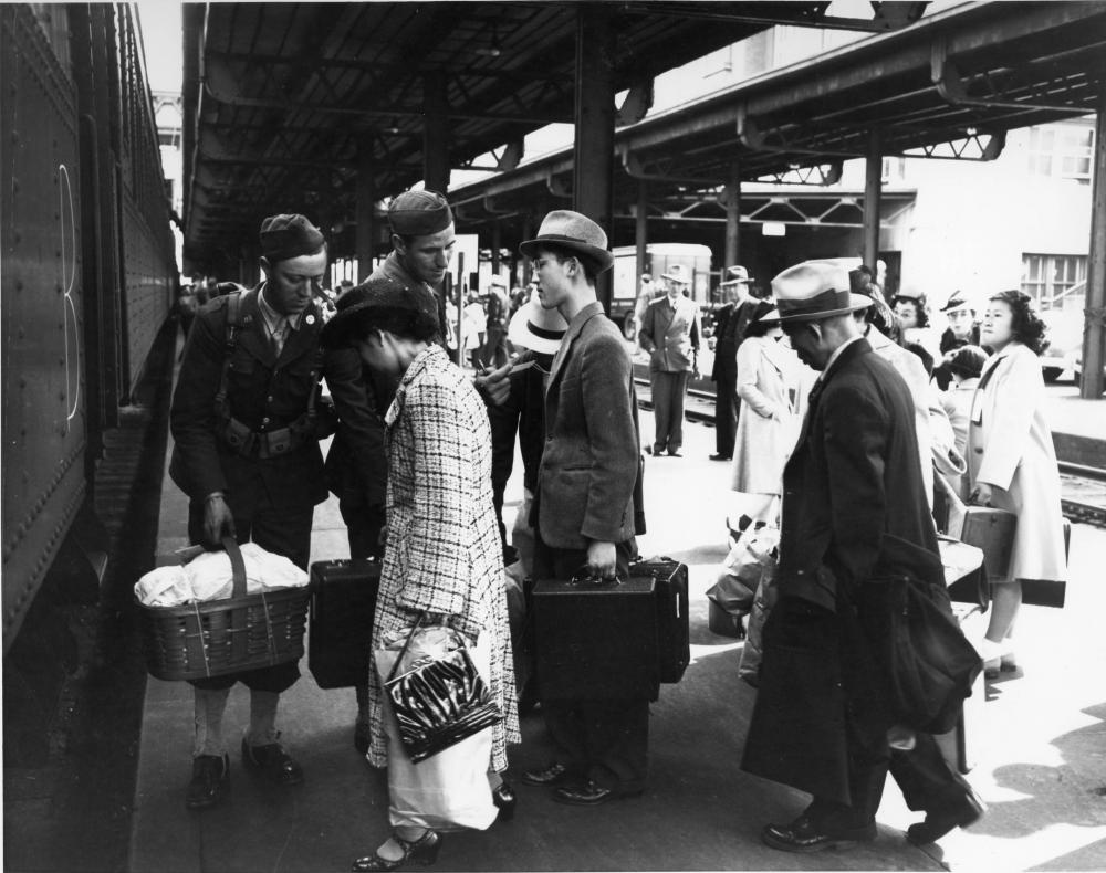 Their presence on the coast considered a national security threat, Tacomas Japanese Americans boarded a train at Union Station to an internment camp (Photo by Richards Studio).