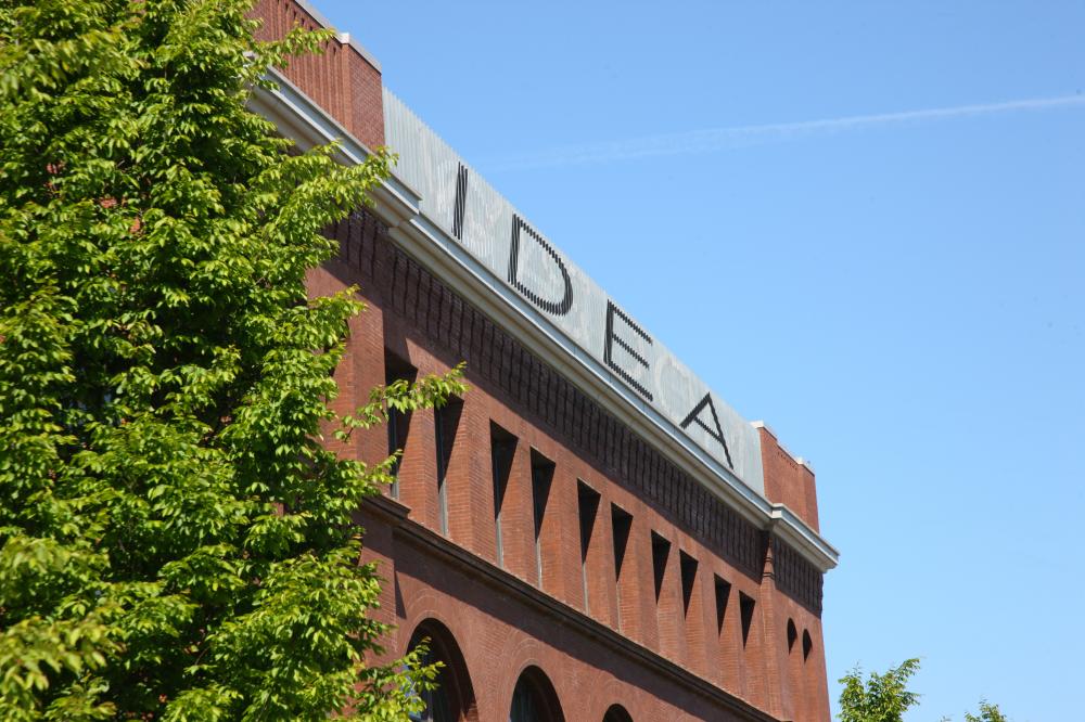 A sign at the top of the UW academic building reading &quot;IDEA&quot; 