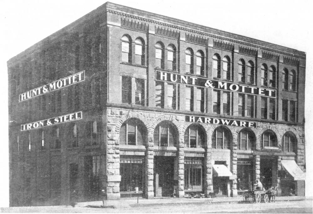 The Sprague Building in 1890, the year it was built, with a horse-drawn carriage near the front door. 