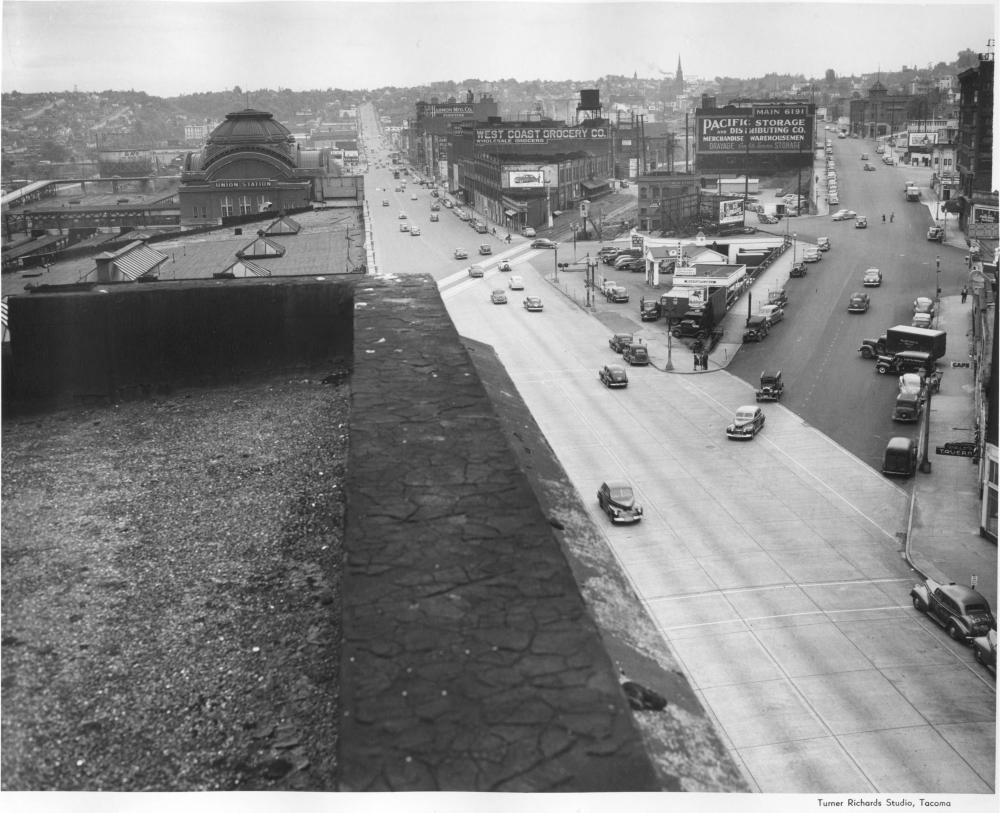 View of the Prairie Line, with West Coast Grocery visible at center, ca. 1947. the ghost sign is still visible today